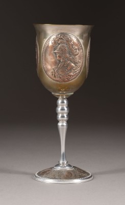 Auction <br>A BRASS GOBLET WITH MEDALS
