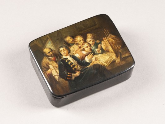 Auction <br>A PAPIER-MACHÉ AND LACQUER BOX DEPICTING PETER THE GREAT EXPLAINING A MODEL OF A SHIP