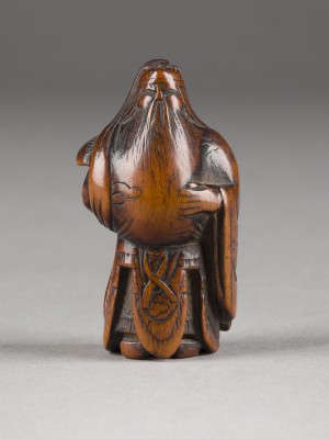 Picture EIN NETSUKE VON KAN'U AUS HOLZ