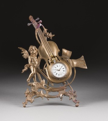 Picture TASCHENUHRSTÄNDER 'PUTTO MIT CELLO' UND INTAKTER TASCHENUHR